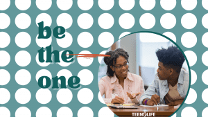 text: be the one image: adult woman of color talking with a teenage boy at a table