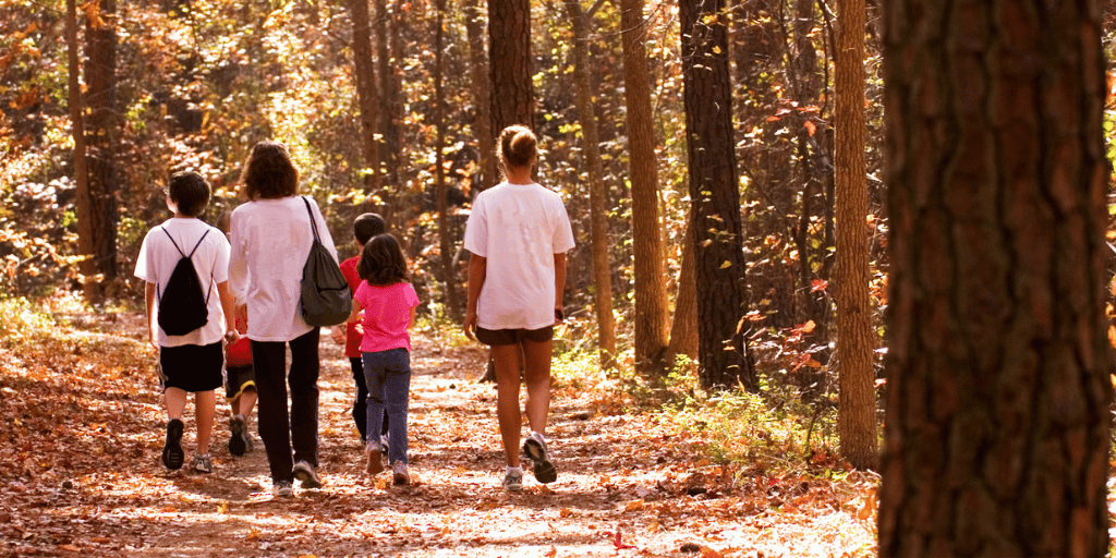 family walking on trail
